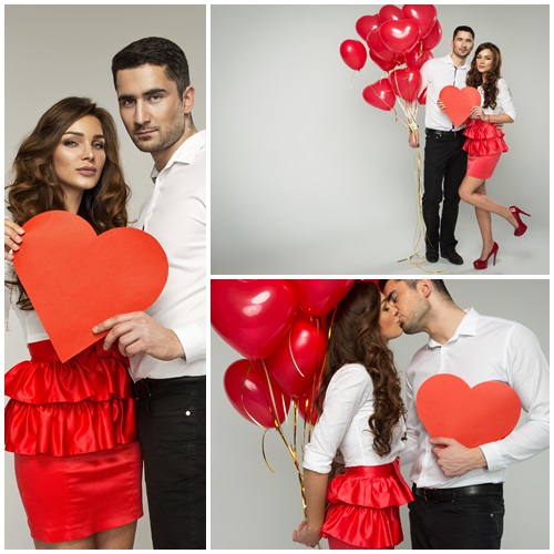 Young couple with ballon hearts - stock photo