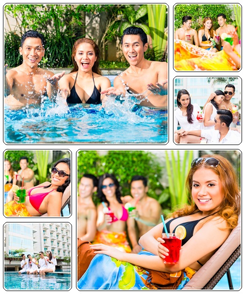 Happy friends at the pool - stock photo
