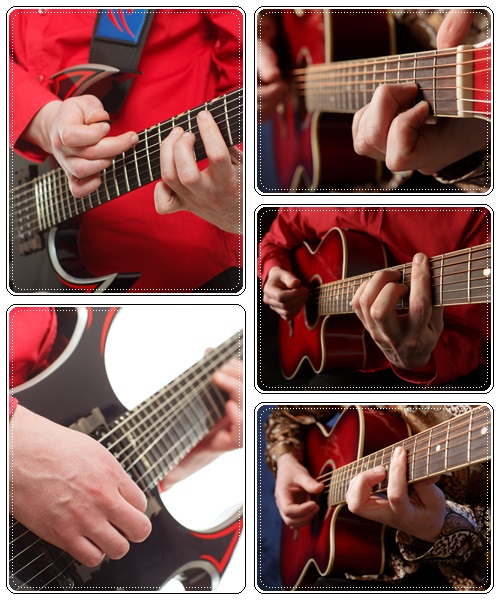Rock guitarist plays solo guitar - stock photo